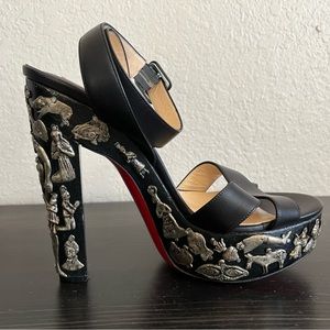 Black Christian Louboutin heels with silver studded images